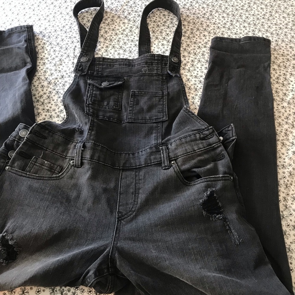 Skinny leg farmer jean one piece with rips on legs